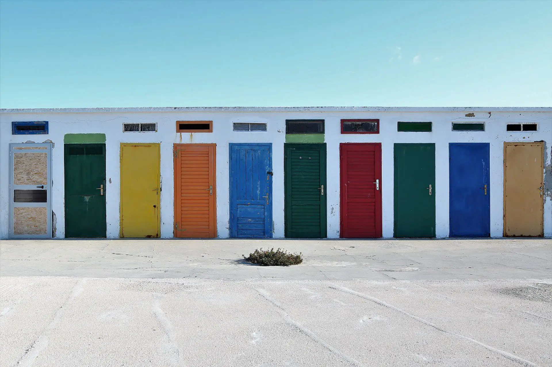 colored cabins on a beach
