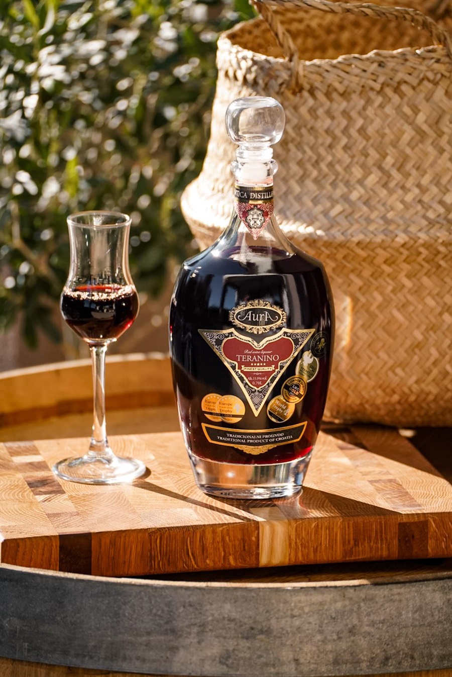 a bottle of a liqueur and a glass